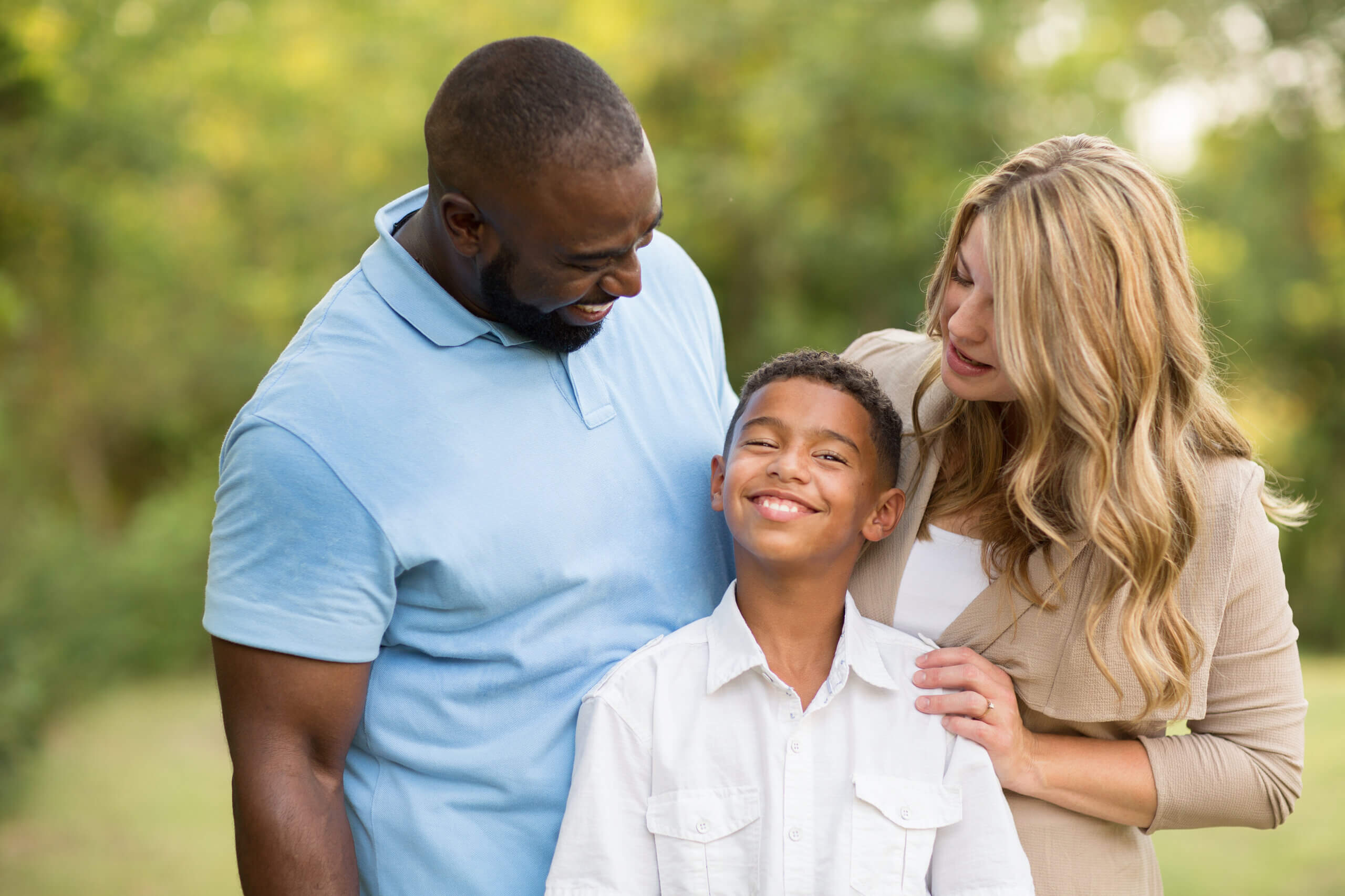 Portrait of a multi ethnic family laughing.